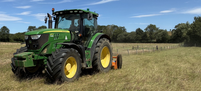 Professional grass topping contractor topping an agricultural field in Oxfordshire.